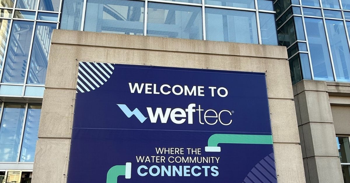 Welcome to WEFTEC banner reading Where the Water Community Connects on the front of the Chicago convention center