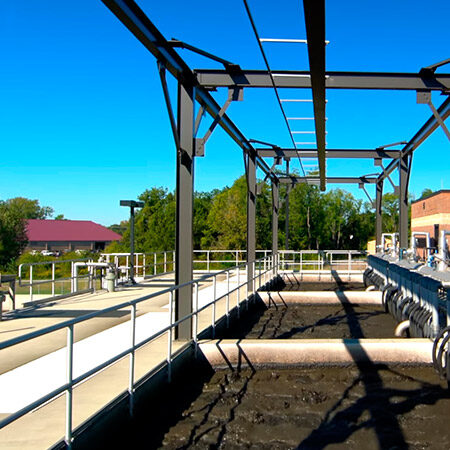 Open aeration basins beneath a steel diffuser gantry at a membrane bioreactor plant